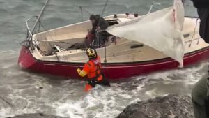 USCG rescues man and dog from sailboat