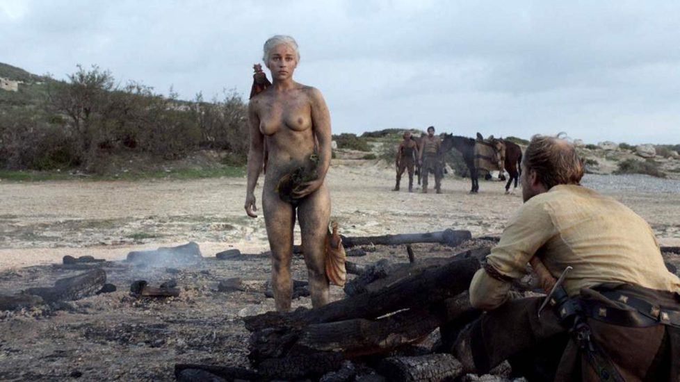 Emilia Clarke stands naked with her dragons after the fire