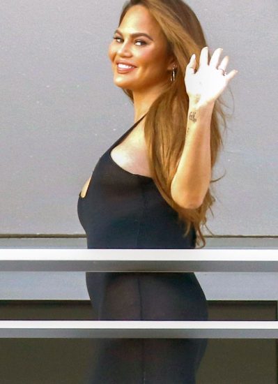 Chrissy Teigen hot and waving