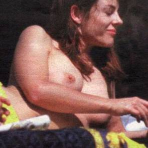 Elizabeth Hurley sunbathes topless