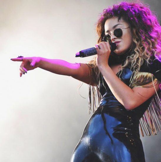 Ella Eyre singing on stage