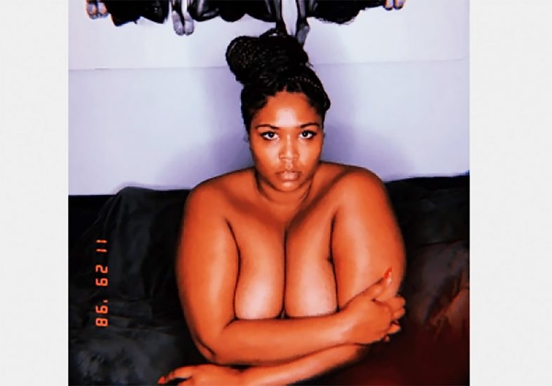 Lizzo is covering her boobs