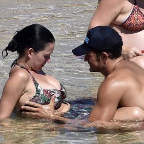 Orlando Bloom holds Katy Perry's tit