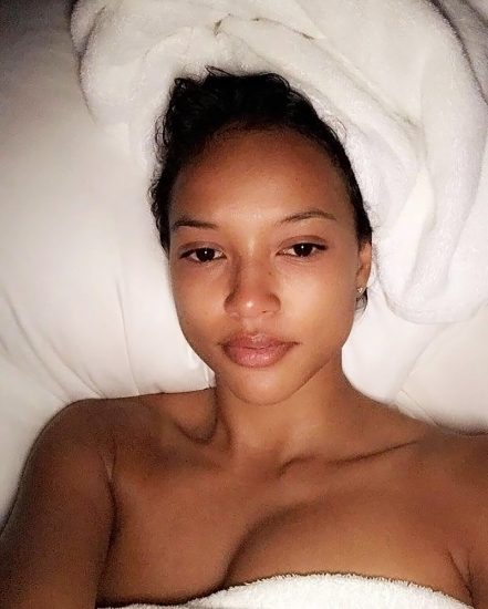 Karrueche Tran naked in bed