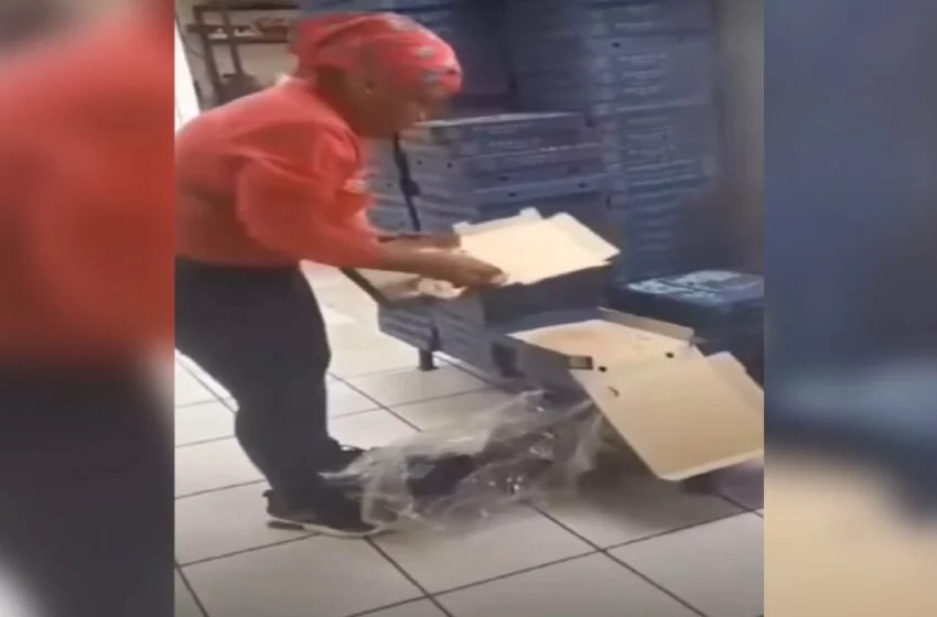 romans pizza video | woman dressed in romans pizza uniform reusing pizza boxes